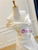Detail shot of the asymmetric, gathered ruches at the waist that create a flattering shape.