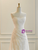 Close-up of the dense, dimensional lace appliques and the delicate strapless neckline.