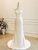 Front view of the stark white satin mermaid gown with a straight neckline and ruched bodice.

