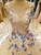 Close-up of butterfly lace appliques and bead details on a tulle A-line evening gown