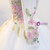 Detailed view of embroidery and beading on the bodice of a white tulle dress