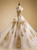 Gold applique A-line wedding dress with sweetheart neckline and sweep train