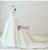 Side view of a dramatic white ball gown wedding dress with full satin skirt