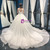 White Ball Gown Tulle Sequins Deep V-neck Backless Wedding Dress
