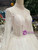 White Tulle High Neck Long Sleeve Backless Wedding Dress With Beading