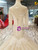 Champagne Tulle Mermaid Long Sleeve Backless Wedding Dress With Beading