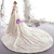 Lace-up back closure on champagne tulle wedding dress with beaded off-shoulder straps