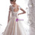 Stunning Bateau Long Sleeve Appliques Backless Champagne Wedding Dress With Long Train