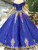 Back view of a lace-up royal blue wedding dress with a sweeping floor-length hem