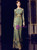 Floor-length mermaid silhouette green sequin MOB gown with sheath fit and long sleeves