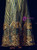 Zipper-up back closure on elegant green sequined mother of the groom dress