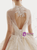 Champagne Tulle Sequins High Neck Backless Beading Wedding Dress With Long Train