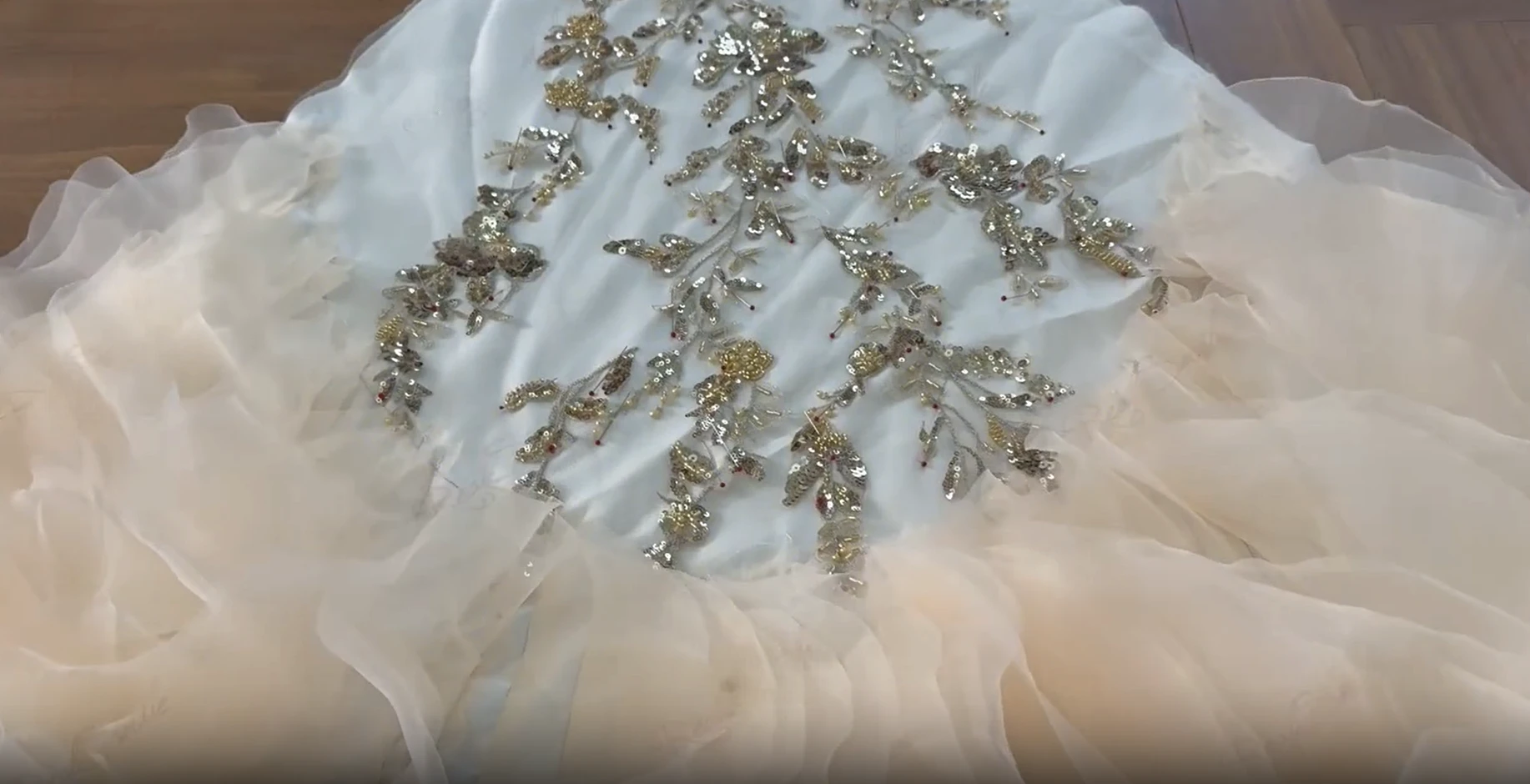 Hand beaded champagne gown skirt with floral appliqué details Hand beaded champagne gown skirt with floral appliqué details