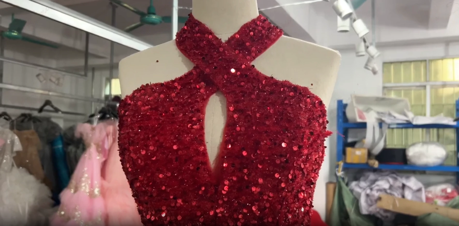 Finished Red Wedding Dress in the Atelier Finished red wedding dress with fitted bodice and dramatic detachable train