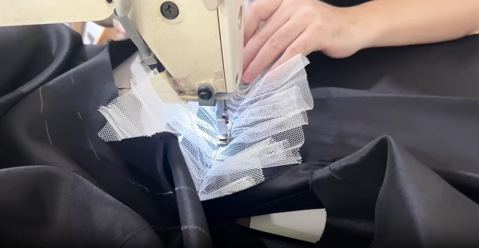 Gathering white net over black tulle for skirt volume