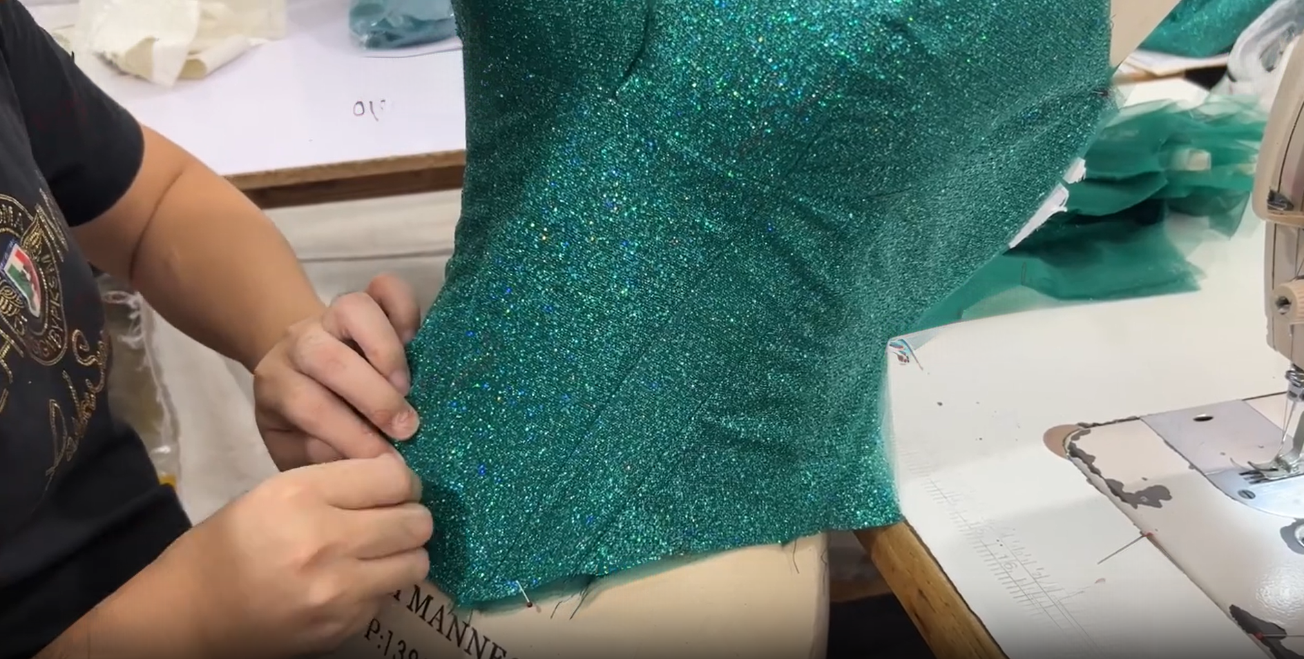 Dressmaker checking glitter bodice fit