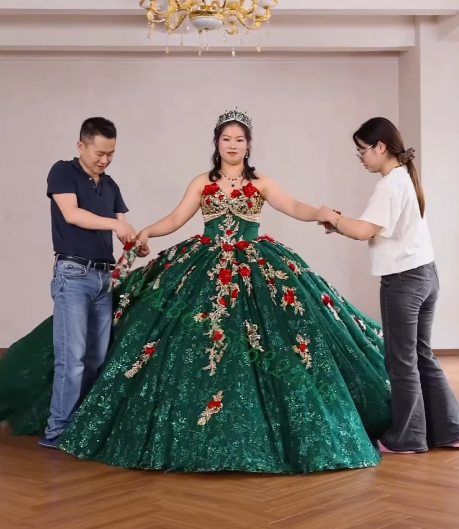 Model wearing finished green floral ball gown