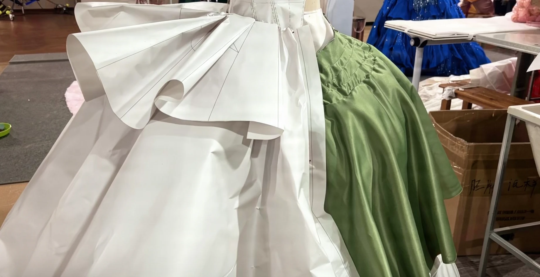 Muslin toile and paper pattern fitting for a black velvet ball gown