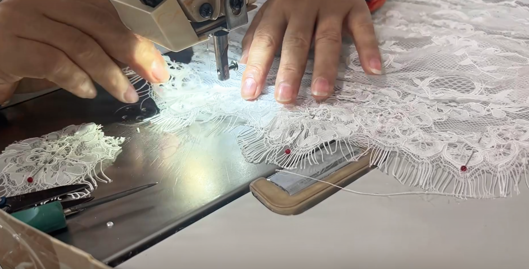 Pinning and sewing eyelash lace panels for a fitted mermaid bridal gown