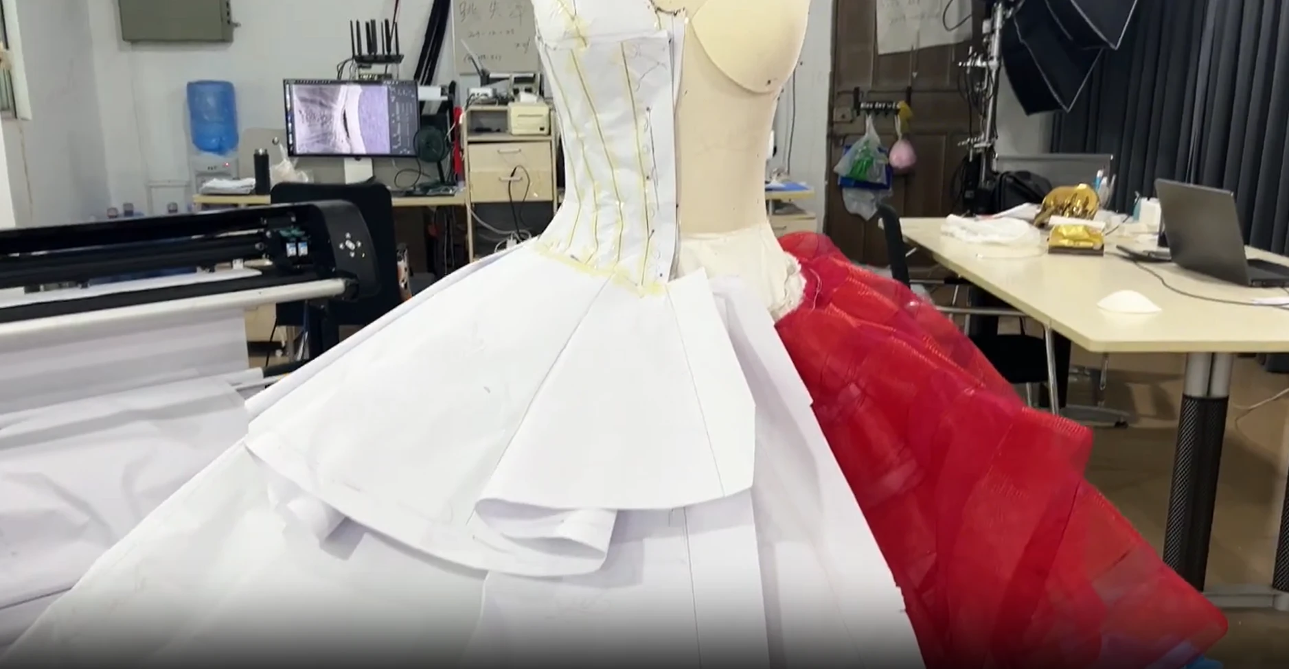 Red and white tulle being tested for the skirt panels