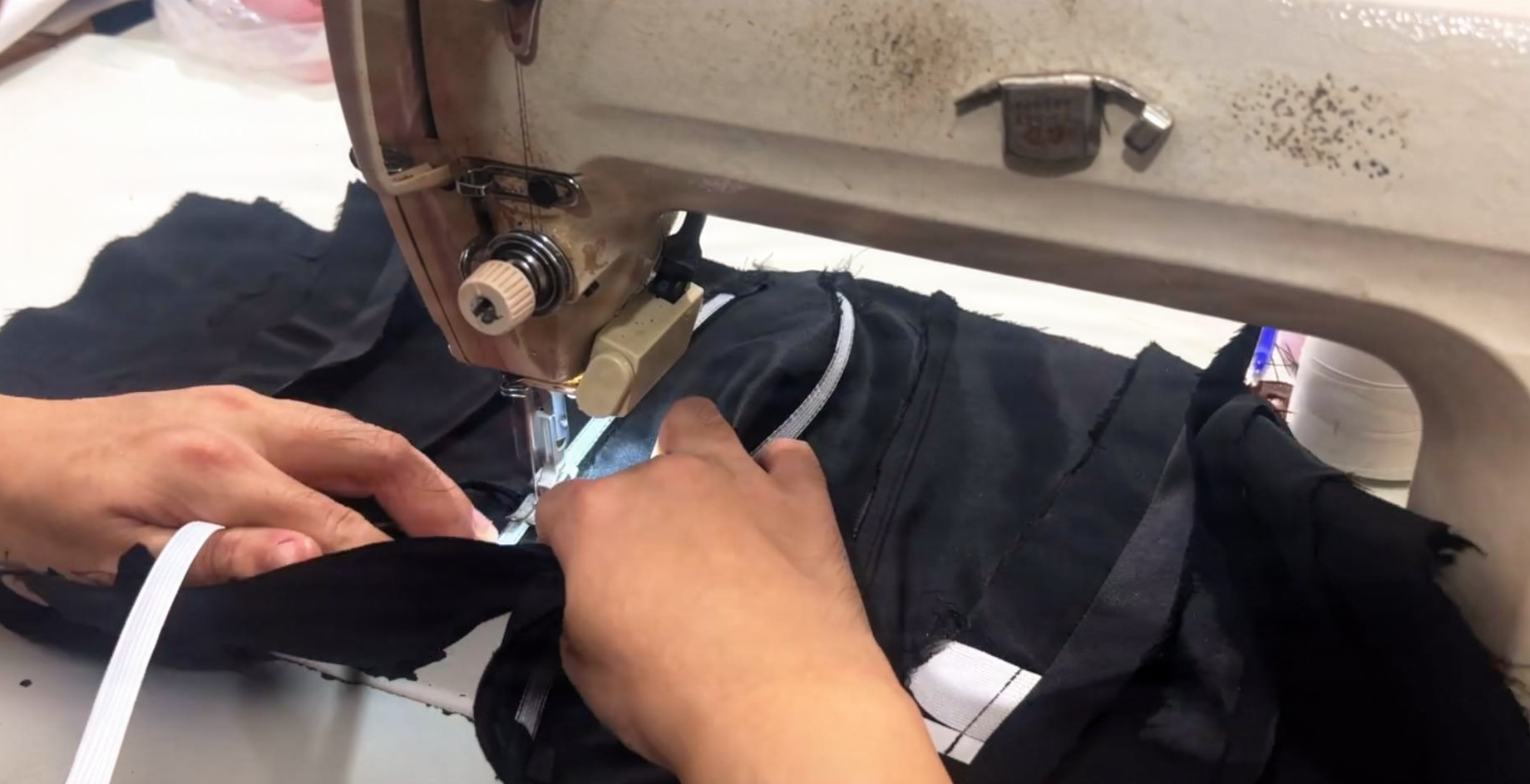 Rigilene woven polyester boning sewn into black wedding gown lining