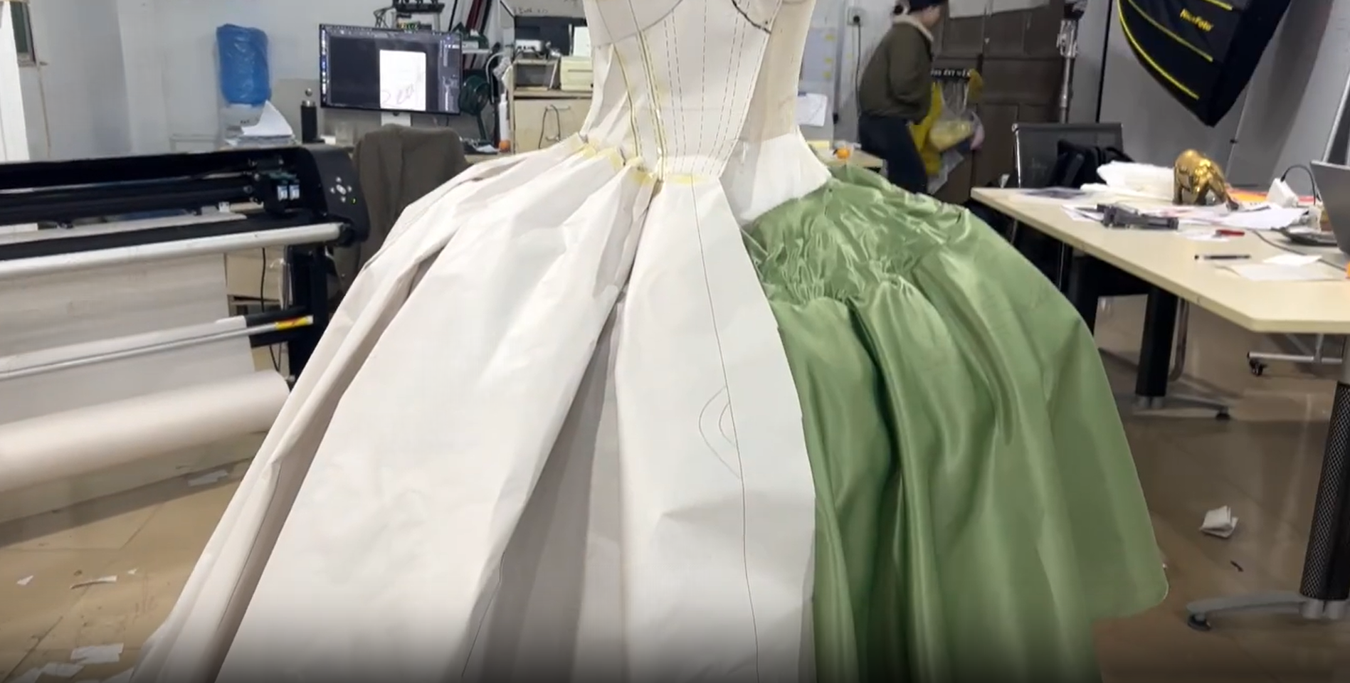 White muslin dress being fitted on dress form