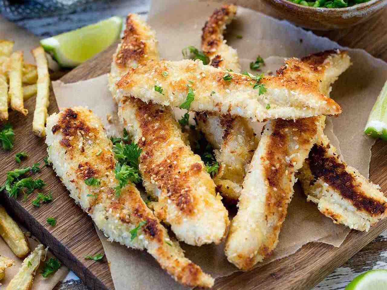 Baked fish and chips with mushy peas