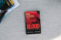 Our Hands Are Stained with Blood (softcover)
