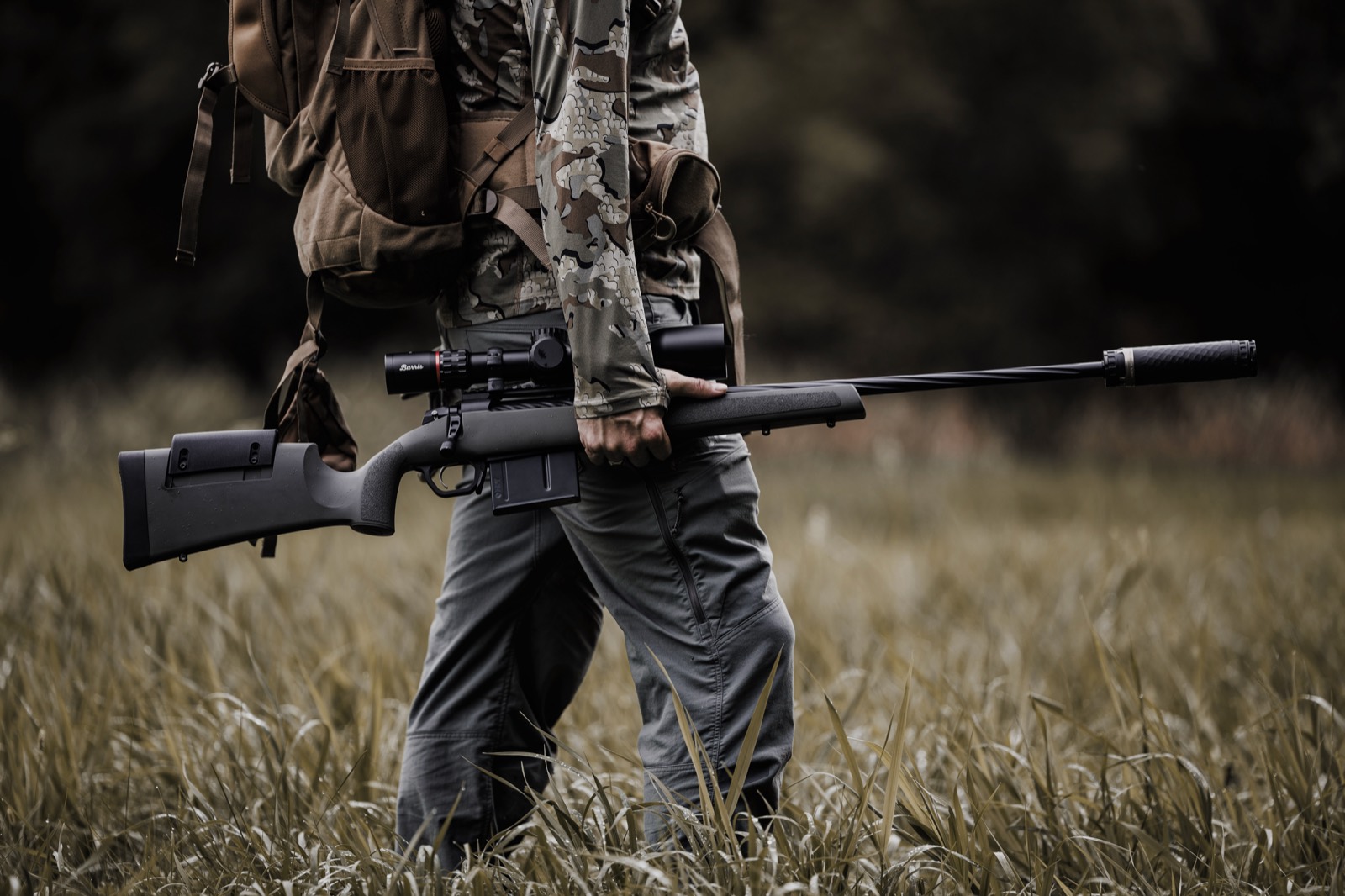 A Precision Armament suppressor mounted on a bolt-action rifle