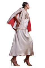 Kashesh Fiza Cape in Ivory: Women's gold and cream handwoven cape jacket made from recycled eco-friendly fabrics, featuring a contrasting luxurious red silk lining