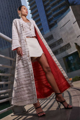Kashesh Haadiya Coat in Ivory: Women's handwoven long jacket made from recycled fabrics, featuring 'Excellence' sequin trim and a red silk lining