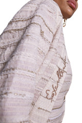 Kashesh Haadiya Coat in Ivory: Women's handwoven long jacket made from recycled fabrics, featuring 'Excellence' sequin trim and a red silk lining