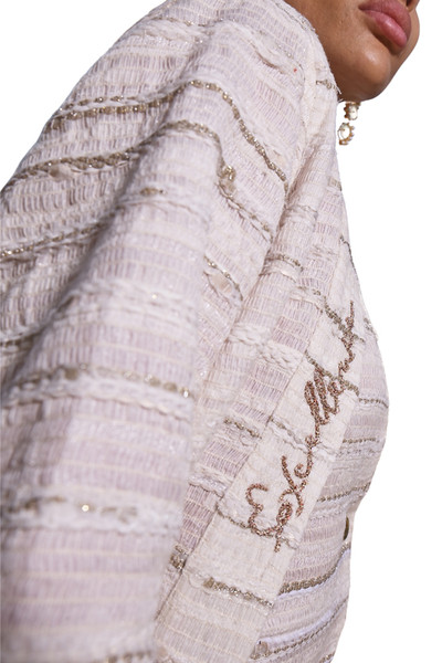 Kashesh Haadiya Coat in Ivory: Women's handwoven long jacket made from recycled fabrics, featuring 'Excellence' sequin trim and a red silk lining