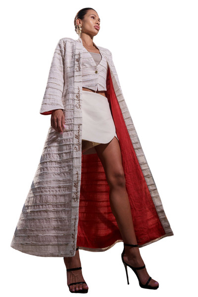 Kashesh Haadiya Coat in Ivory: Women's handwoven long jacket made from recycled fabrics, featuring 'Excellence' sequin trim and a red silk lining