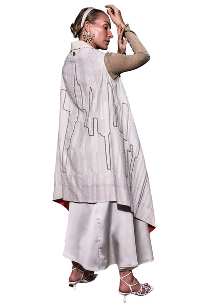Kashesh Mahira Coat Ivory - Cream handwoven women's vest jacket featuring a glittering sequin Dubai skyline design and recycled fabric texture