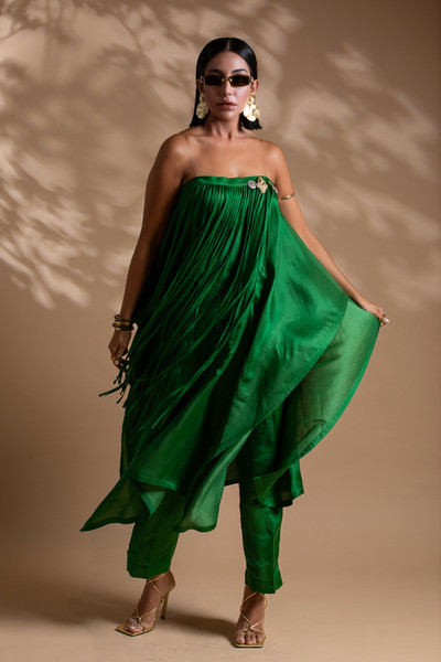 Kashesh 'Fuljadi' emerald green strapless ensemble featuring a flowing 50/50 linen-satin top with delicate tassel accents and a detachable brooch, paired with slim tailored pants