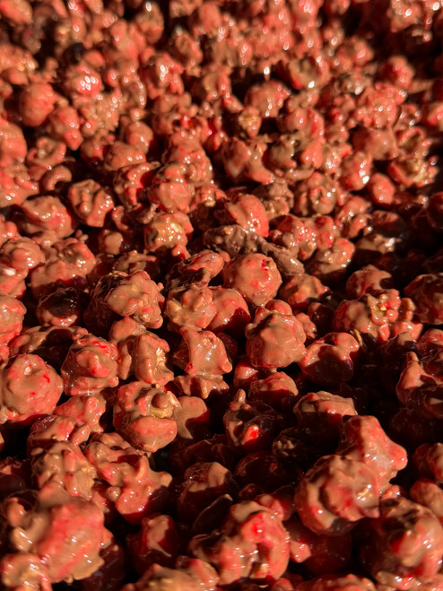Milk chocolate drizzled strawberry gourmet popcorn
