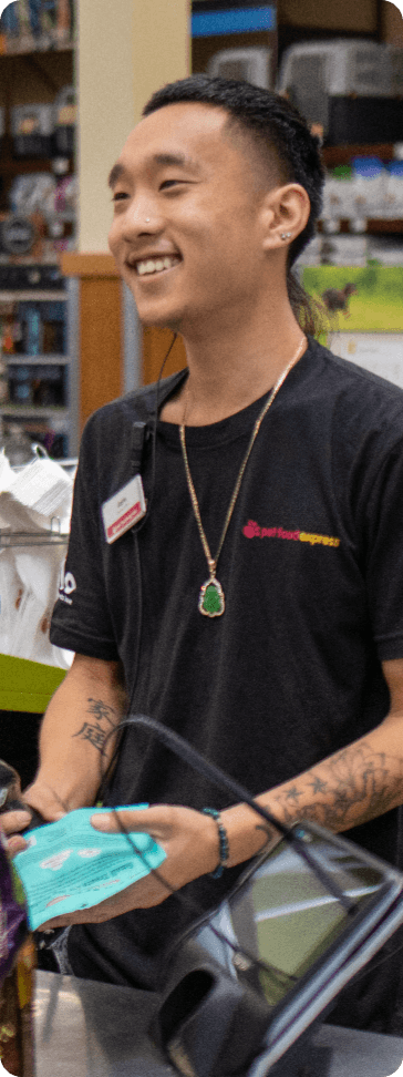 action shot of a Pet Food Express employee