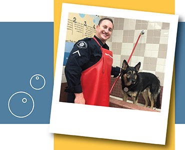 police officer washing pet 