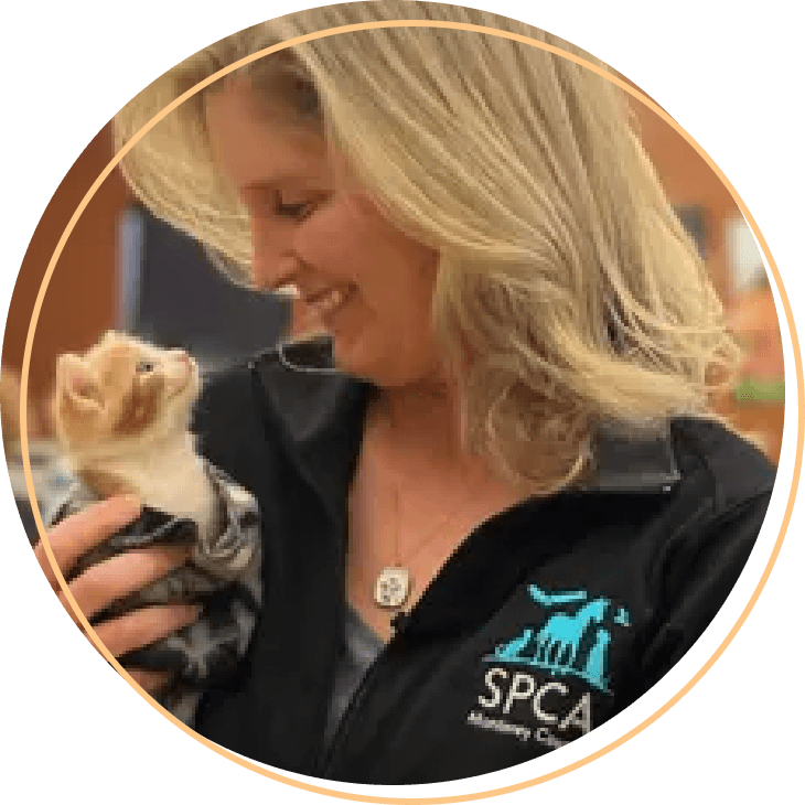 woman holds kitten