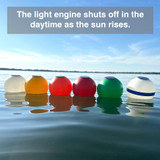 Daytime view of solar-powered buoys in multiple colors floating in water, auto-off light engine in sunlight"