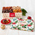 Priester’s Comfort & Joy Christmas gift tin with 3 lbs. of assorted pecans, a festive foliage lid, and red and gold ornaments.