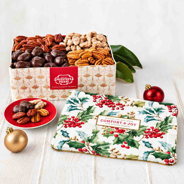 Priester’s Comfort & Joy Christmas gift tin with 3 lbs. of assorted pecans, a festive foliage lid, and red and gold ornaments.