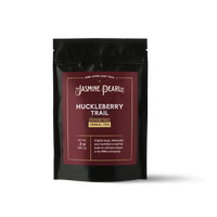 2 oz. packaging for Huckleberry Trail herbal blend from the Jasmine Pearl Tea Co.
