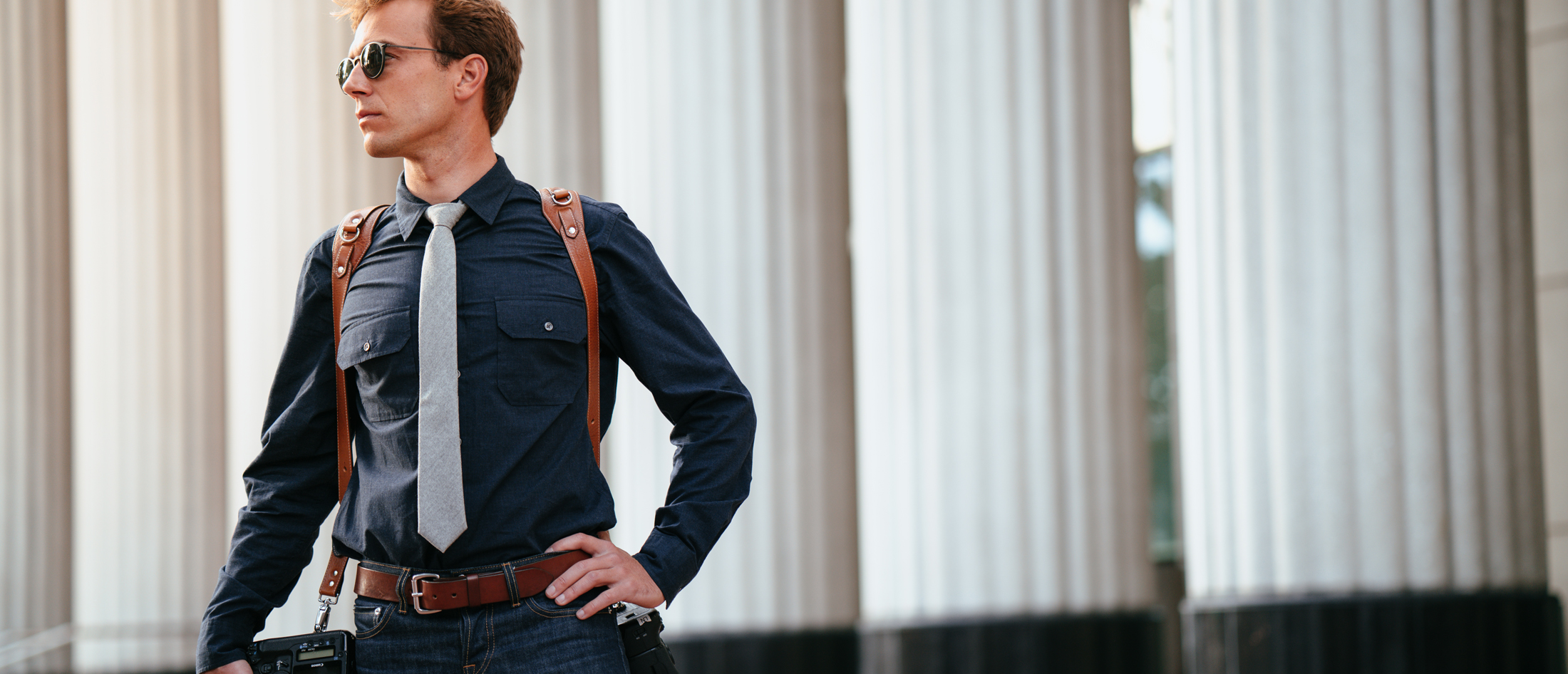 Leather camera harness worn on assignment