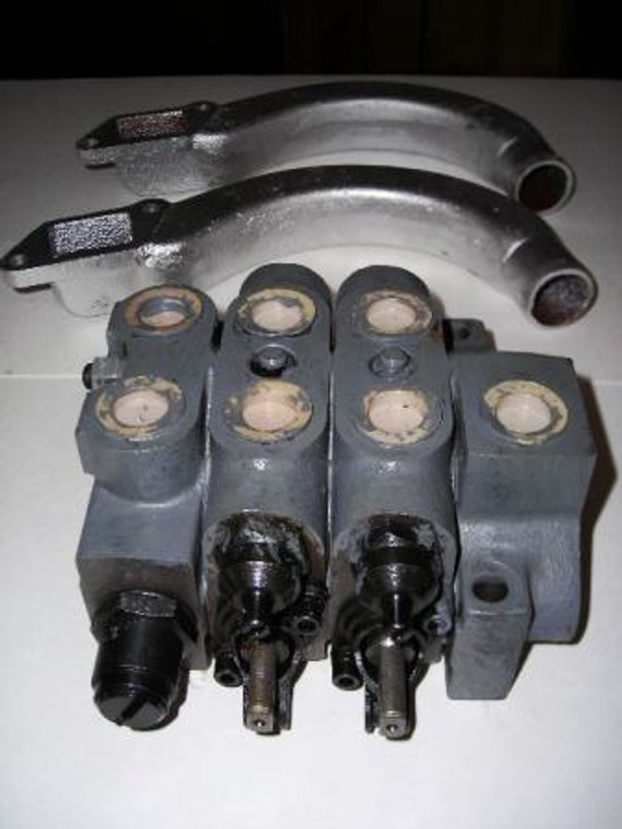 Multi way valve for rear hydraulic outlets