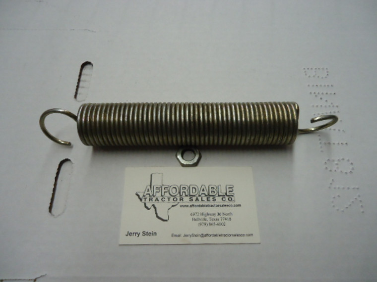 Tension spring for feed roller