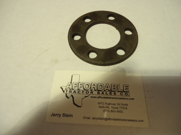 Flywheel bolt backing plate
