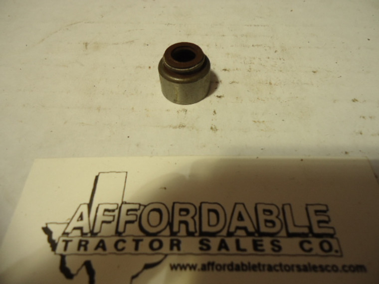 Valve guide cap/seal