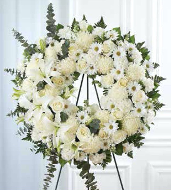 Handcrafted funeral wreath displayed on an easel for a celebration of life service in Gilbertsville, PA